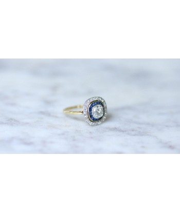 Bague Art Deco halo diamants et saphirs calibrés rembourrage situé sous